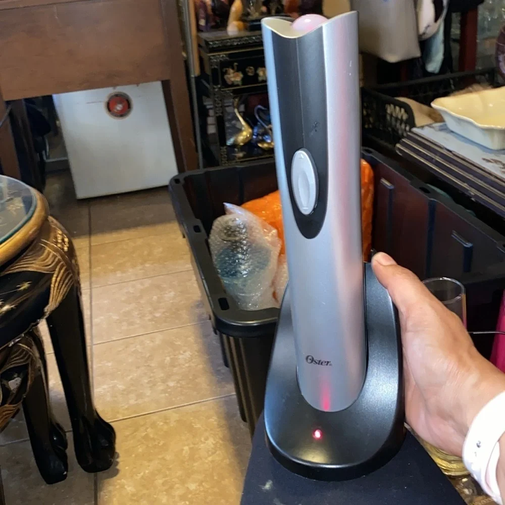 Bx47 Oster electric wine opener works fine